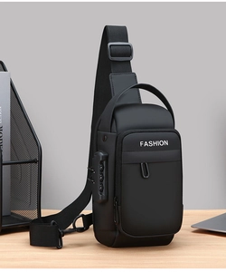 Detail of multi-functional black sling bag featuring integrated anti-theft combination lock