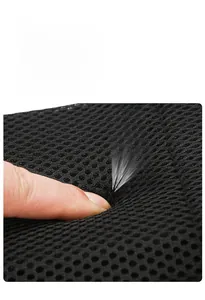 Close-up of breathable honeycomb mesh padding with elastic massage feature for shoulder support