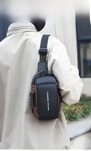 Detail view of anti-theft chest bag featuring a 3-digit combination lock and fashion text