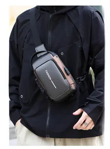 Detail of men's sling bag featuring a 3-digit security lock and integrated USB port