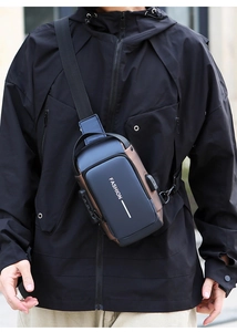 Detail of waterproof chest bag with anti-theft lock and integrated USB charging port