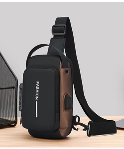 Detail view of anti-theft lock and USB charging port on a stylish men's chest bag