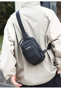 Men's black chest bag with anti-theft lock and USB port shown on model outdoors