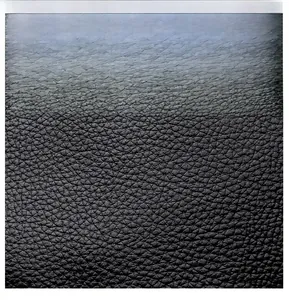Close-up of black lychee grain leather material showing durable texture and softness