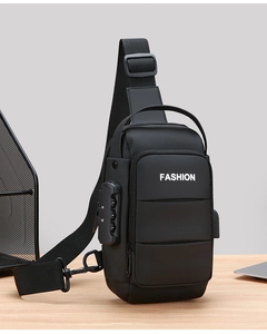 Detail of black crossbody bag with three-digit security lock and USB charging port