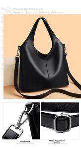 Detail of black lychee grain leather tote bag showing gunmetal hardware and stitching