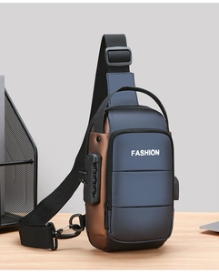 Detail of waterproof men's sling bag featuring a security combination lock and USB port