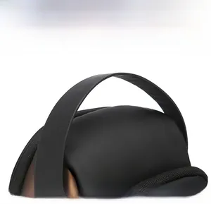 Close-up of the widened synthetic leather handle with reinforced stitching on a black chest bag