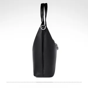 Side view of black lychee grain bucket bag featuring silver rings and large capacity
