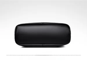 Detailed view of the black lychee pattern leather base with reinforced stitching