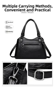 Detail of black pebbled PU leather tote with silver hardware and adjustable strap options