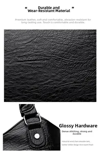 Close-up of black lychee grain leather texture with white stitching and metal chain hardware