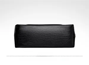 Detail view showing black washed leather bottom with precise stitching and lychee grain texture