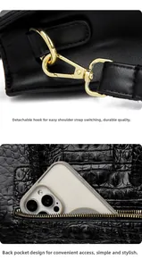 Detail of crocodile pattern handbag with detachable golden hook and back zipper pocket