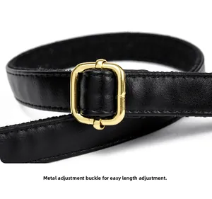 Close-up of litchi texture leather strap with adjustable golden buckle for handbags