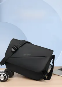 Waterproof black messenger bag featuring modern geometric lines and adjustable strap detail