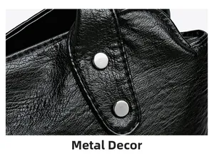 Gros plan sur cuir grainé noir avec détails de rivets métalliques argentés polis