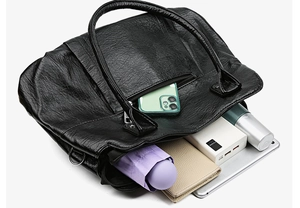 Interior view showing large capacity for tablet, wallet, and umbrella in black tote bag