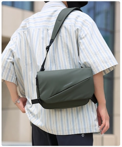 Detail of waterproof men messenger bag with adjustable strap and decorative text