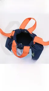 Detail view of nylon crossbody bag interior and contrast color front pocket storage