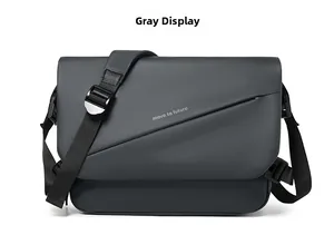 Detail of dark grey waterproof messenger bag with Move to Future text and adjustable strap