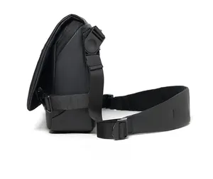 Side view detail of waterproof black messenger bag with adjustable wide shoulder strap