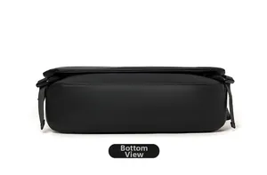 Detailed bottom view of minimalist black waterproof messenger bag with nylon straps