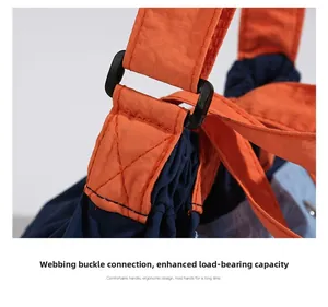 Detail of durable nylon strap buckle and reinforced stitching on crossbody bag