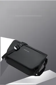 Detail of black crossbody bag with adjustable buckle and Move to Future print