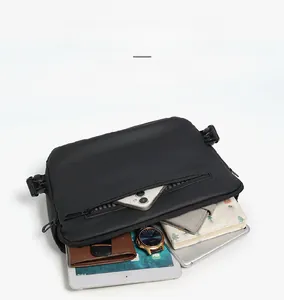 Detail of multi-compartment interior showing storage for tablet and accessories