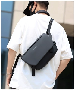 Detail of waterproof black crossbody bag showing the Move to Future print on the flap