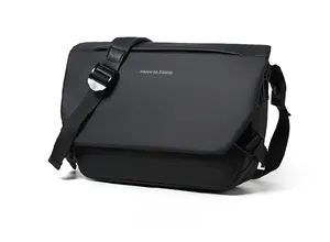 Detail of matte black crossbody bag featuring move to future print and metal buckle