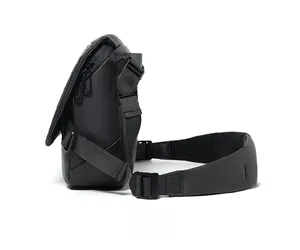 Side view of black waterproof crossbody bag with adjustable shoulder strap and padded protector