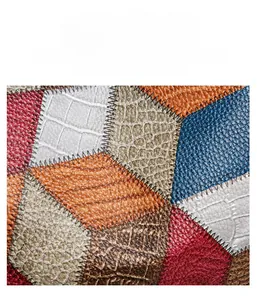 Detail of colorful patchwork PU leather with crocodile and ostrich textures and stitching