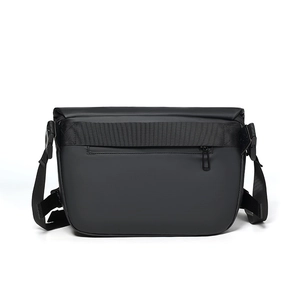 Back view of black waterproof crossbody bag featuring a hidden zipper pocket and nylon strap
