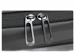Detail shot of heavy-duty SBS double metal zippers on black waterproof sports bag