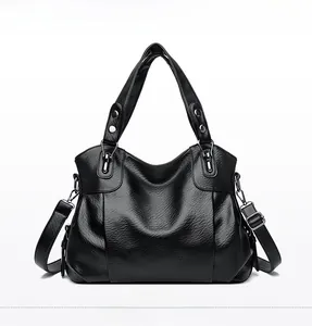 Front view of black soft leather handbag with silver metal buckles and dual handles