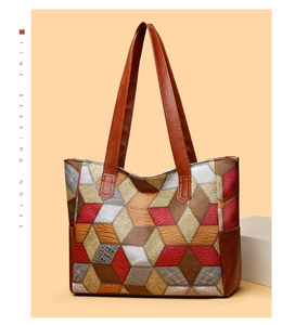 Detail of colorful geometric patchwork PU leather tote with textured 3D pattern surface