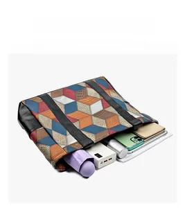 Macro view of a spacious tote bag with geometric patterns showing internal storage space