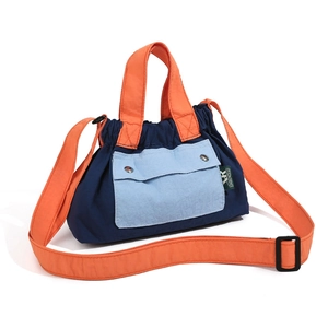 Contrast color nylon crossbody bag with orange handles and blue drawstring closure