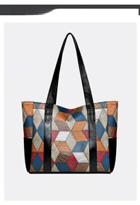Detail of multi-color patchwork tote bag with crocodile and lizard embossed PU leather