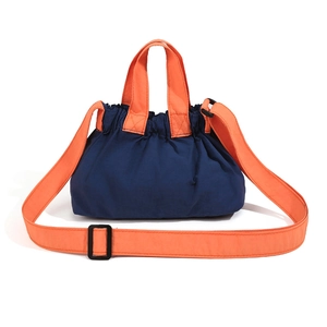 Contrast nylon crossbody bag in navy blue and orange with drawstring closure