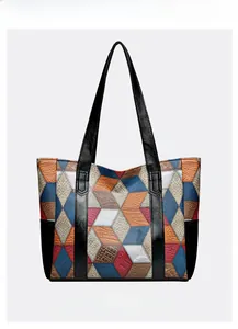 Detailed view of large capacity tote bag with colorful geometric patchwork and textures