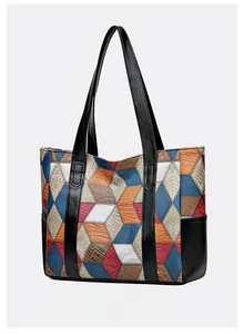 Detail view of colorful geometric patchwork tote bag with high-quality textured PU leather