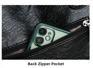 Macro detail of a black pebbled leather bag featuring a functional back zipper pocket