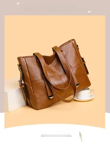 Détails du grand sac cabas marron avec texture grainée et finitions métalliques élégantes