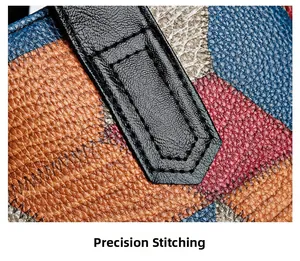 Macro shot of precise stitching on multi-color pebbled PU leather patchwork tote bag