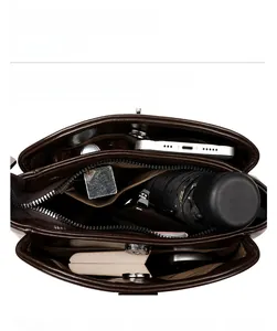 Interior view of vintage brown leather bucket bag showing organized storage compartments