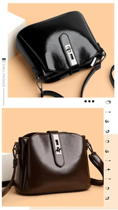 Detail of vintage shell bag with polished leather finish and silver twist-lock closure