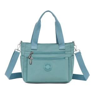 Large capacity nylon tote bag with multi-pocket design and adjustable shoulder strap